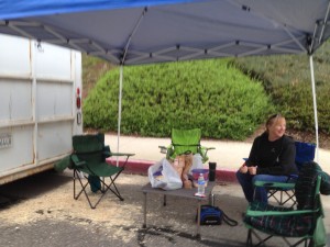 The humans set up camp beside the trailer.