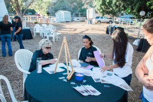 Hanaeleh volunteers Dee Ebell, Lydia Moore, Misa Harada and Tracy Charles put together horse bios that were on each stall