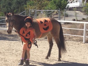 Stella and her girl both dressed up as pumpkins!